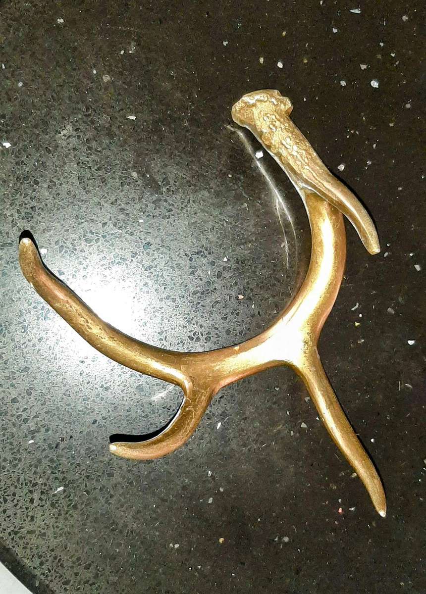 Pair of aluminum brass plated andlers.