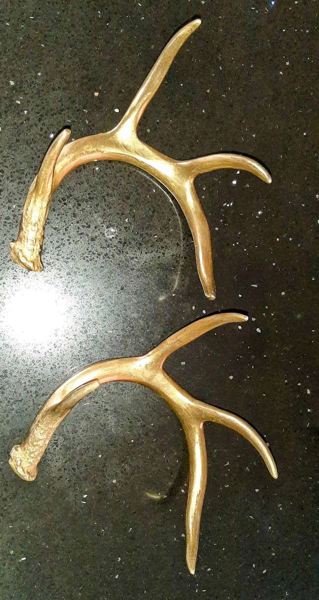 Pair of aluminum brass plated andlers.