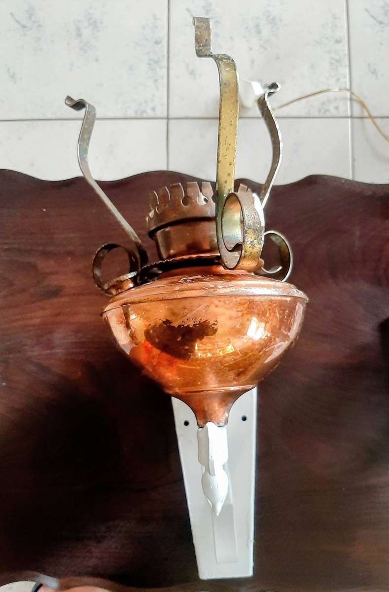 Vintage scone copper oil lamps converted to electric.