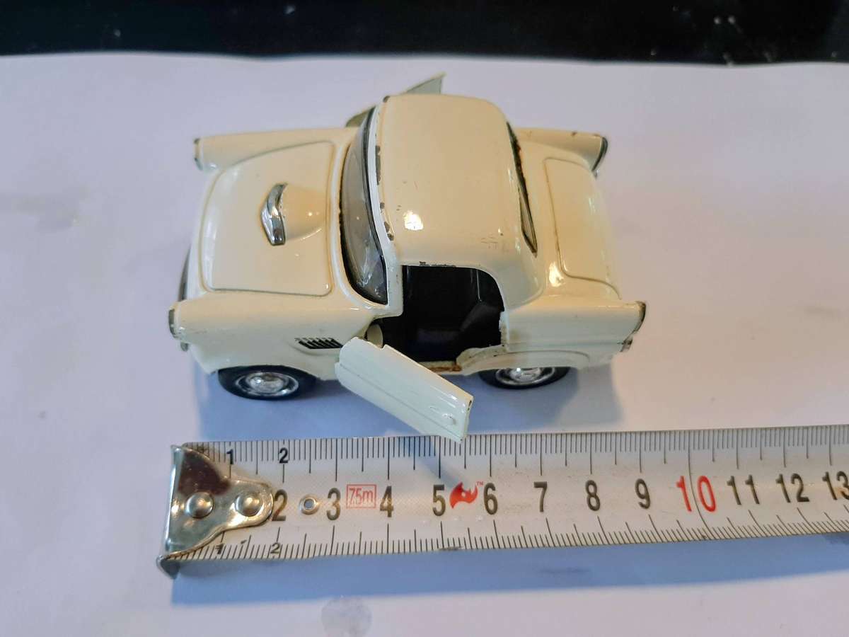 Vintage die-cast model of a 1955 Ford Thunderbird. This model is a replica.