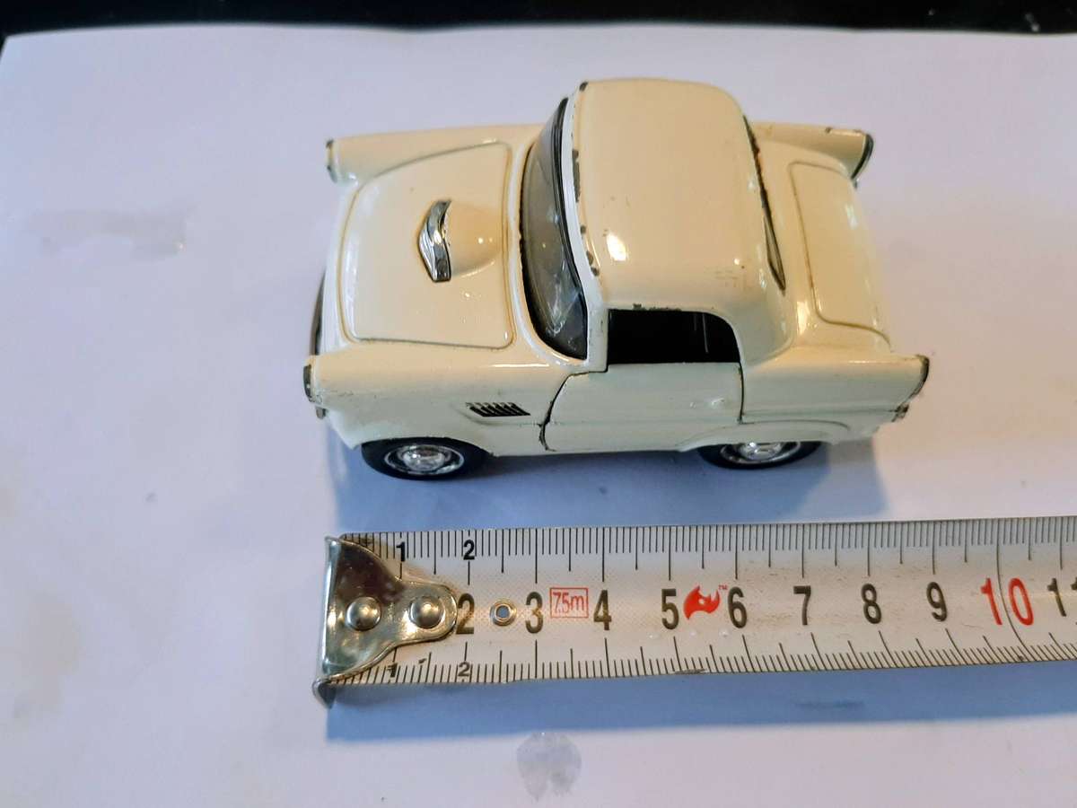 Vintage die-cast model of a 1955 Ford Thunderbird. This model is a replica.