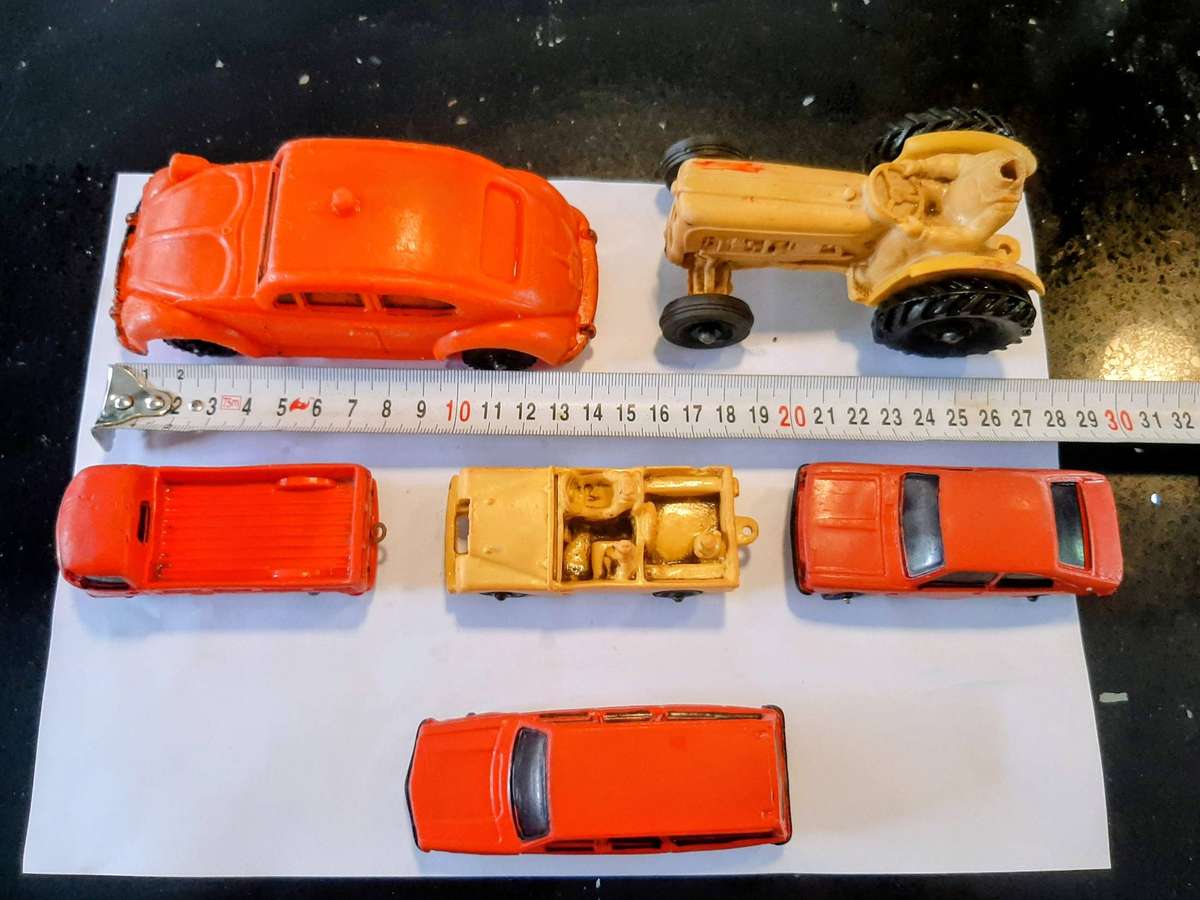 Vintage rubber toy cars, likely from the Norwegian brand Tomte Laerdal.