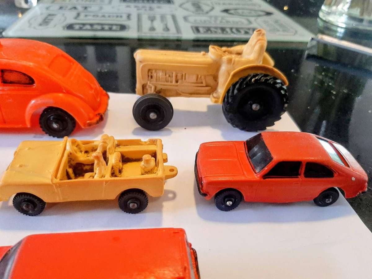 Vintage rubber toy cars, likely from the Norwegian brand Tomte Laerdal.