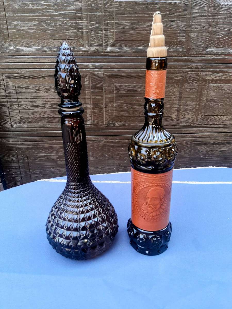 Vintage empoli decantor and liquor bottle wrapped in leather.r