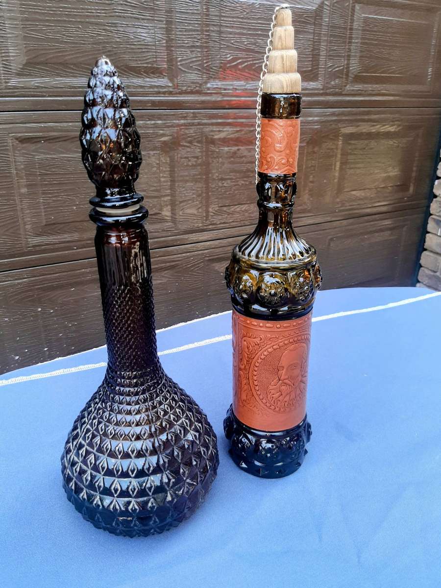 Vintage empoli decantor and liquor bottle wrapped in leather.r