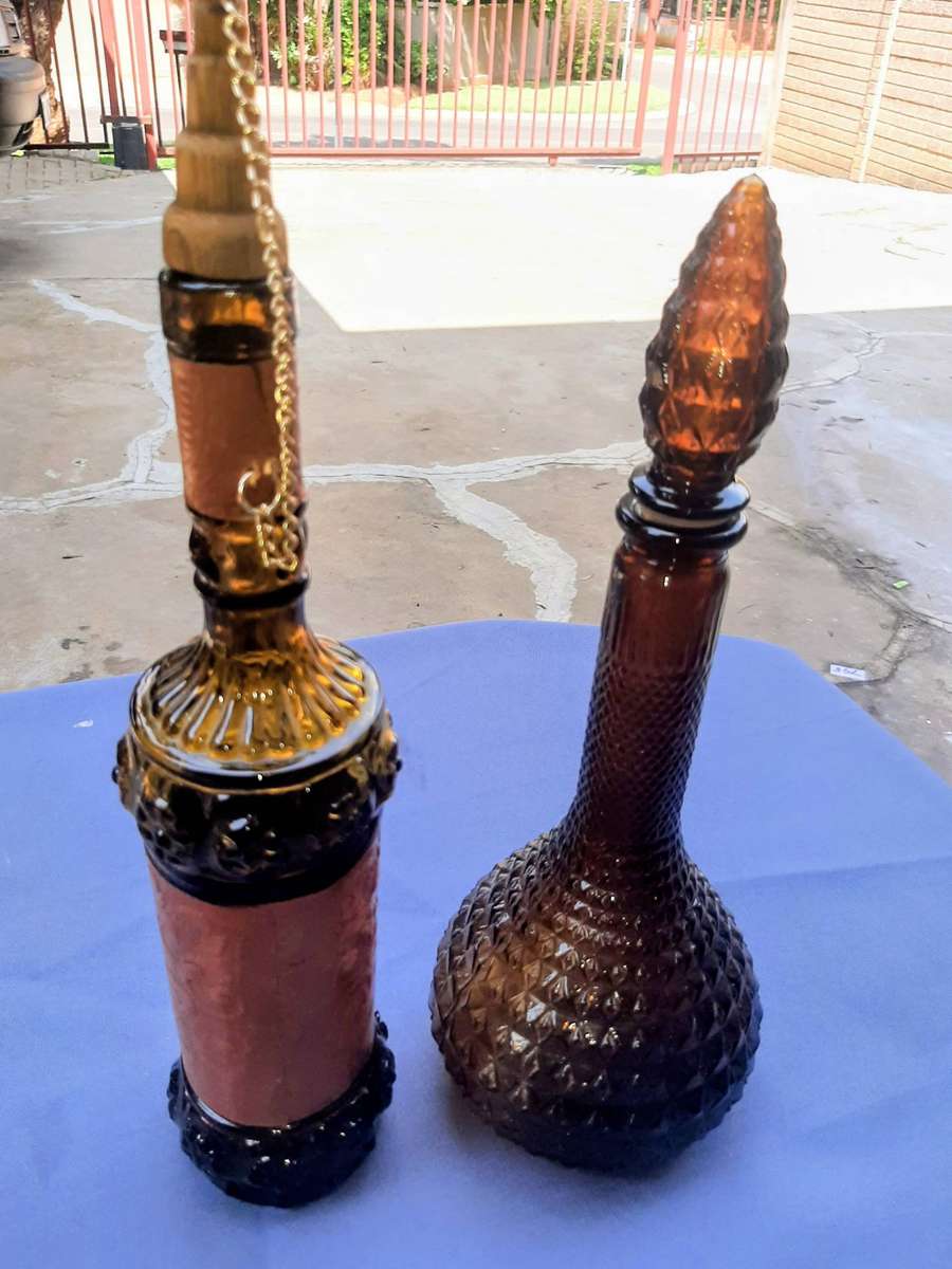 Vintage empoli decantor and liquor bottle wrapped in leather.r