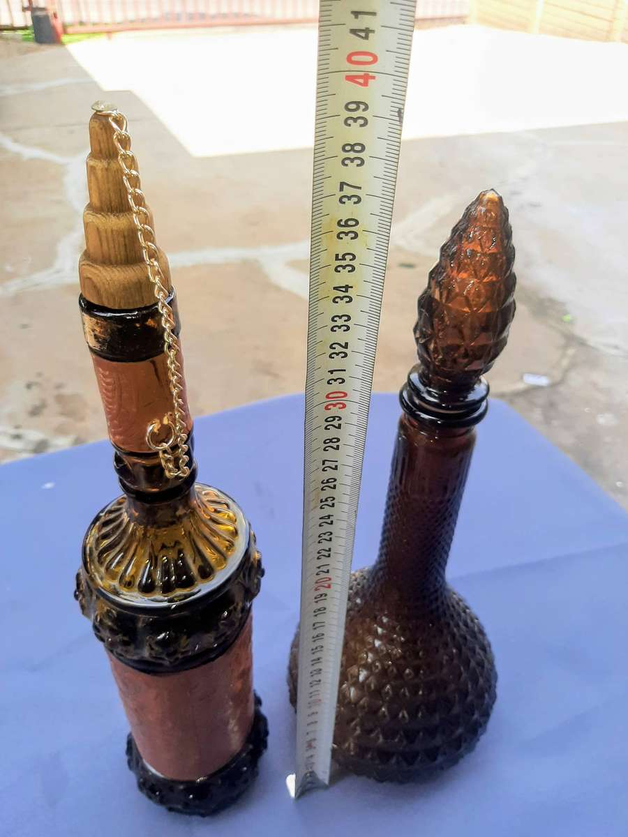 Vintage empoli decantor and liquor bottle wrapped in leather.r