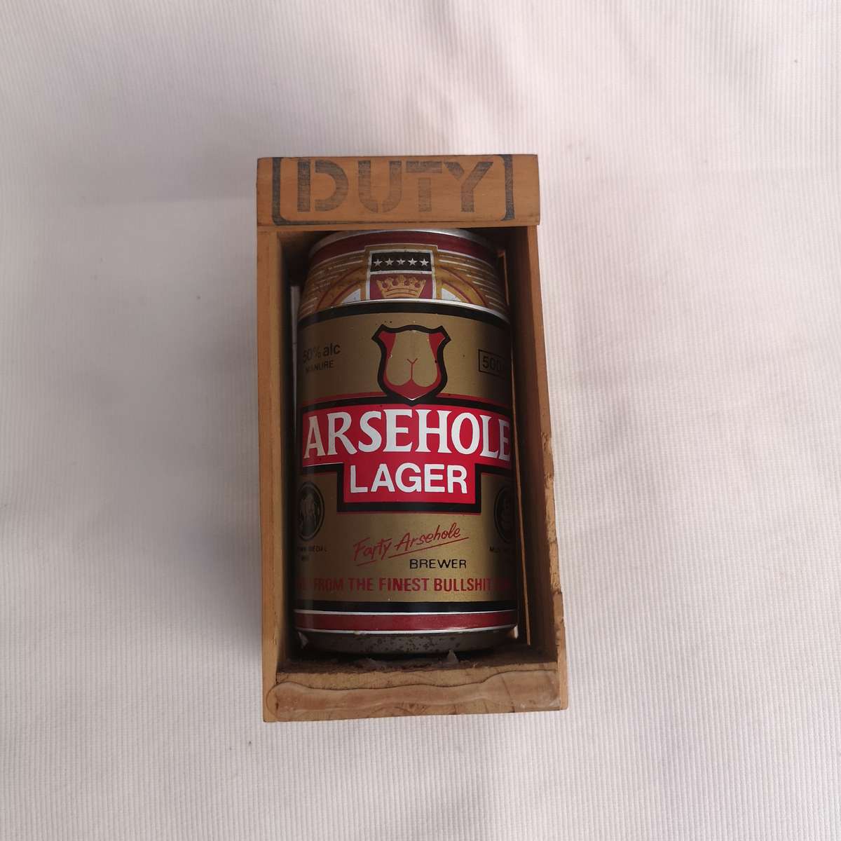 Parody Beer can in Crate- A##hole Lager