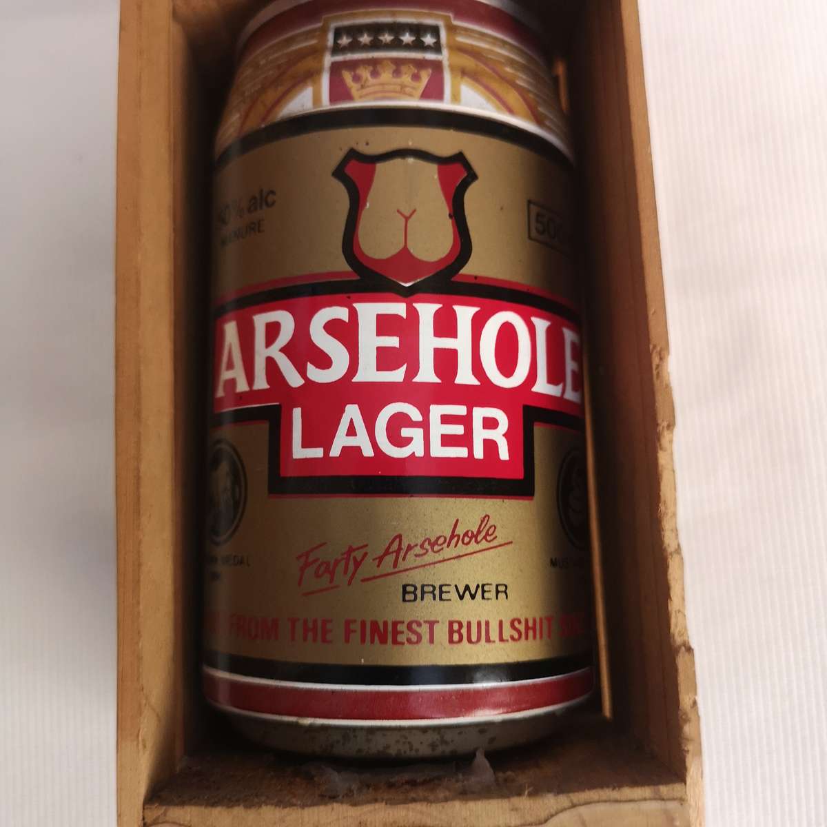Parody Beer can in Crate- A##hole Lager
