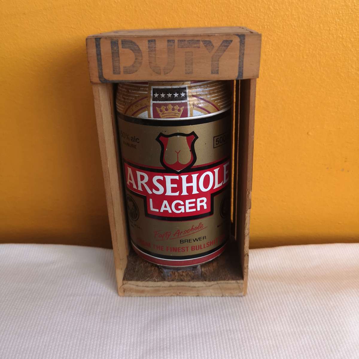 Parody Beer can in Crate- A##hole Lager