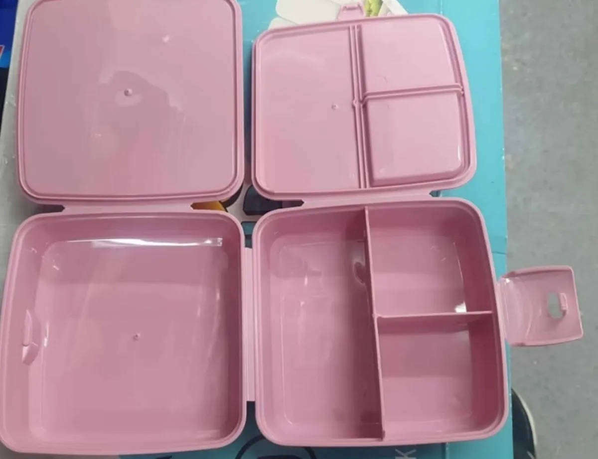 Pink Bento style layered lunchbox with utensils