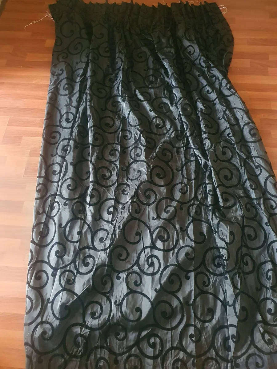 Black taffeta curtain with swirl pattern
