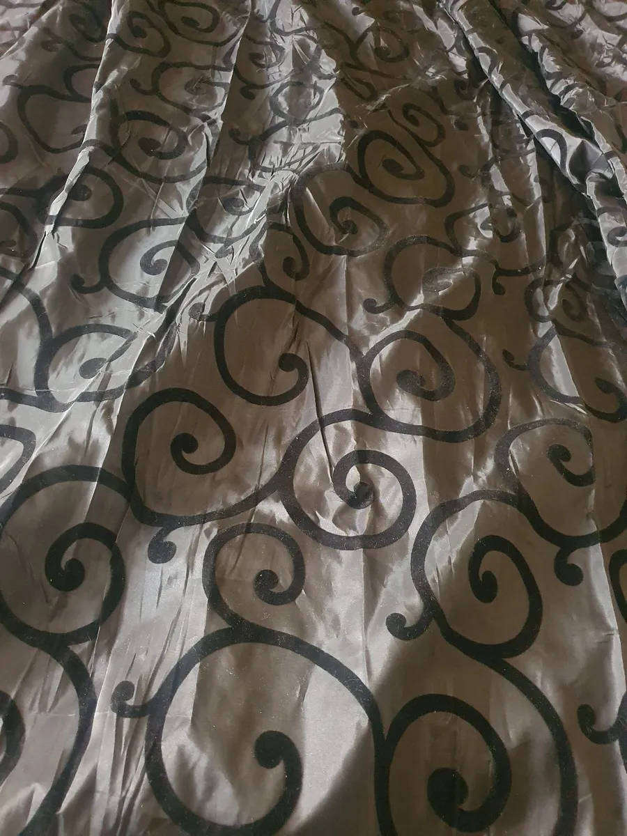 Black taffeta curtain with swirl pattern