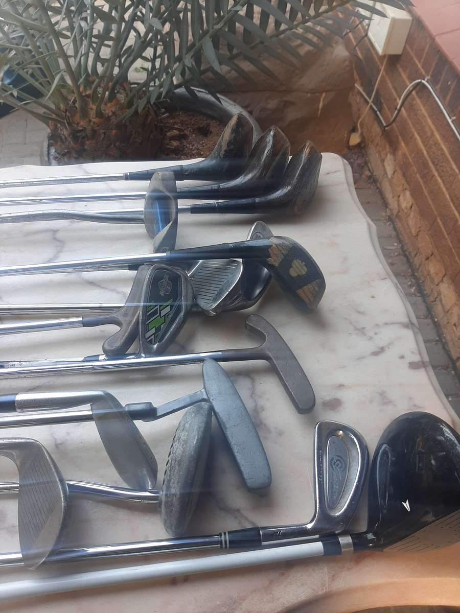 Assorted golf clubs