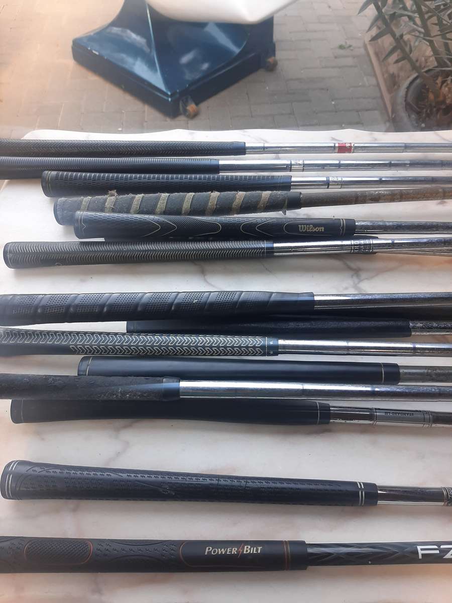 Assorted golf clubs