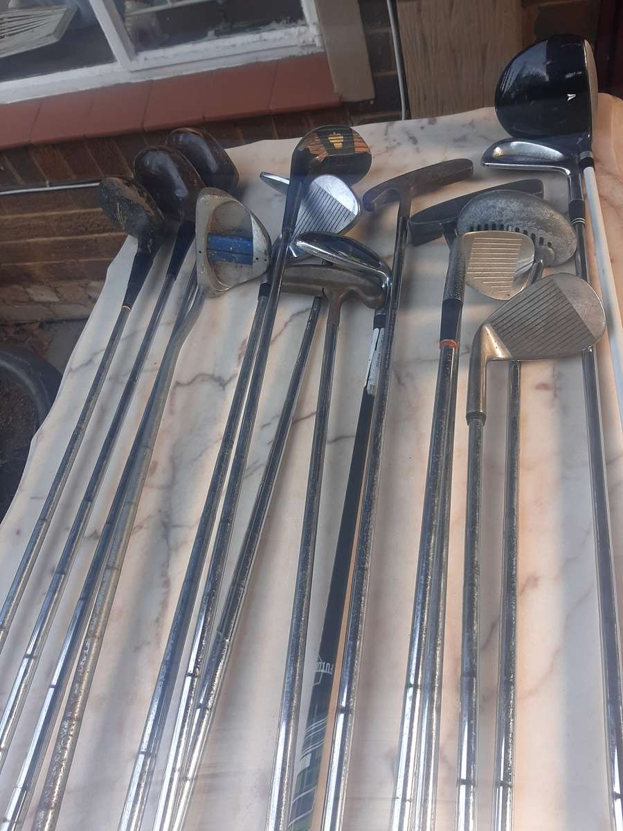 Assorted golf clubs