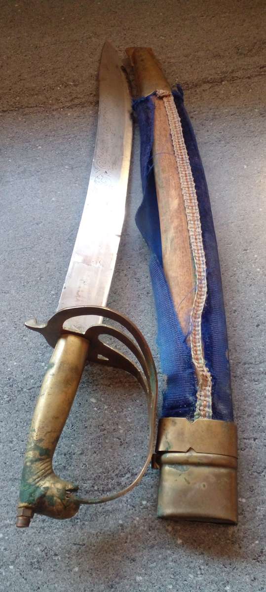 VINTAGE INDIAN SWORD  , WITH BRASS HORSE HEAD  HANDLE AND ORIGINAL WOODEN SCABBARD.
