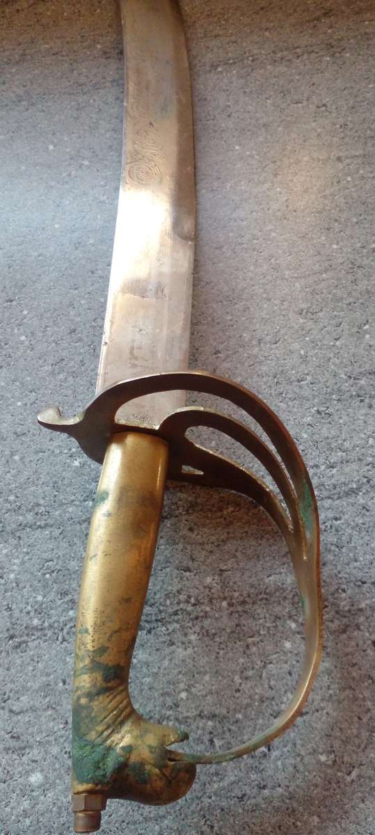 VINTAGE INDIAN SWORD  , WITH BRASS HORSE HEAD  HANDLE AND ORIGINAL WOODEN SCABBARD.