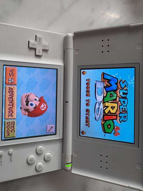 NINTENDO DS LITE CONSOLE CLEAN CONDITION WHITE WITH 7 X ORIGINAL GAMES