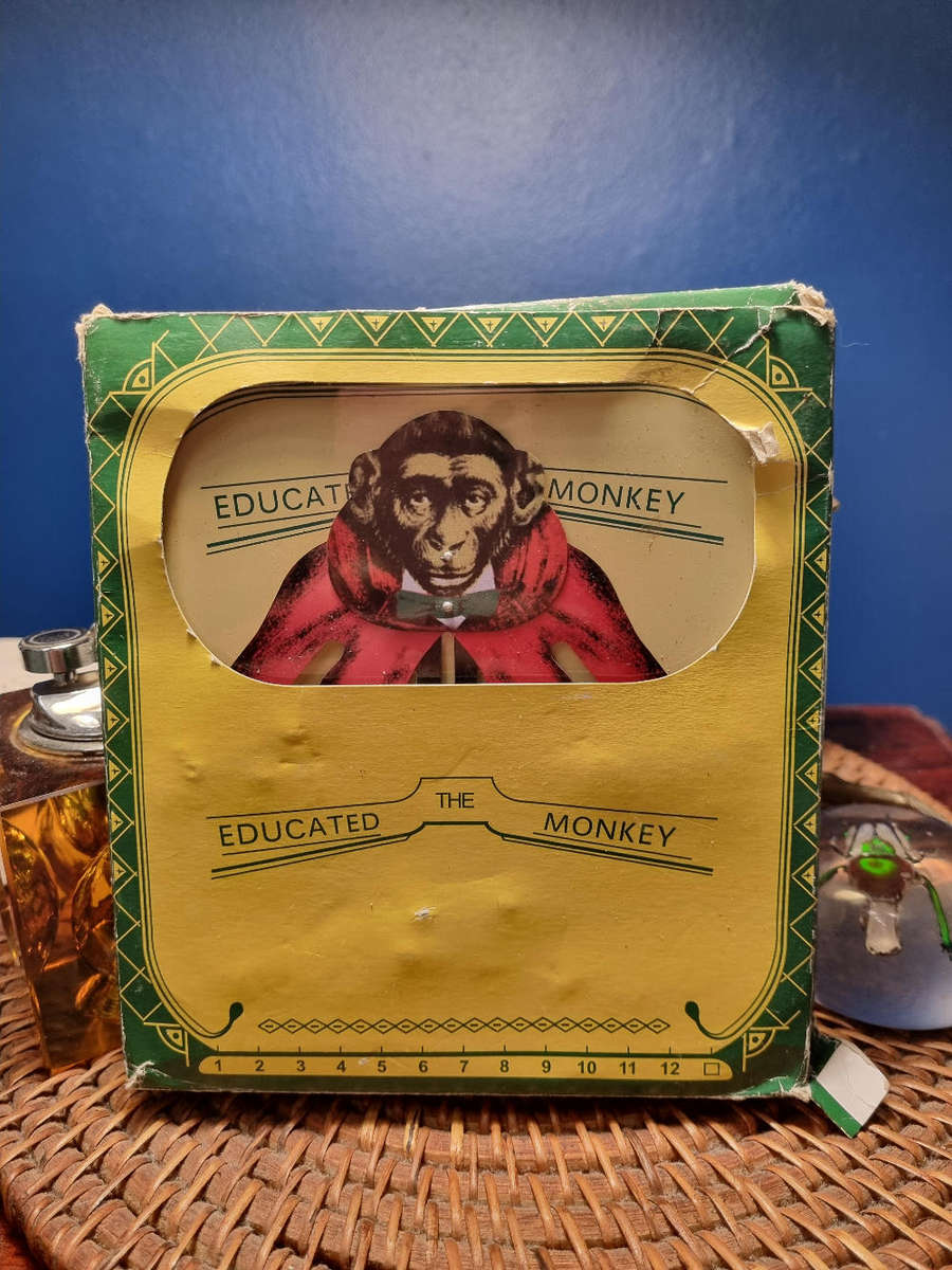The Educated Monkey Tin Toy