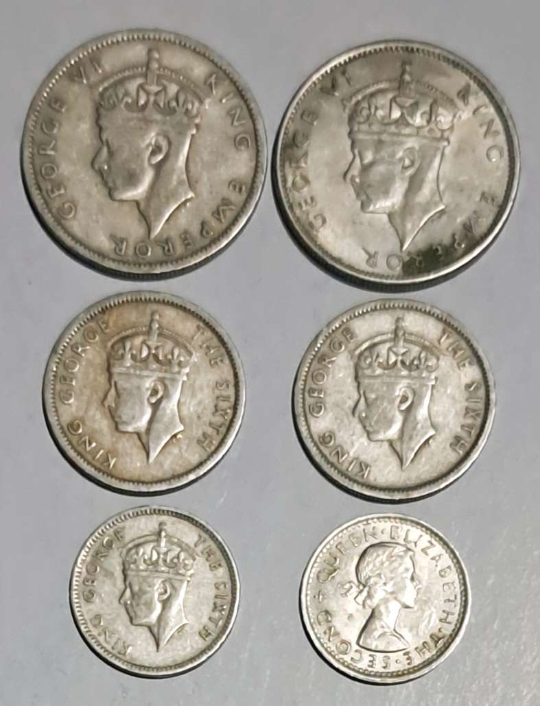 Southern Rhodesia 6 coins  --2 one shilling --2 sixpence -- 2 Threepence coins.