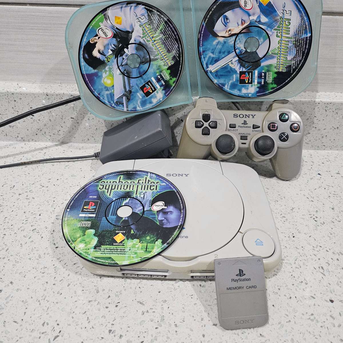 COLLECTABLE ORIGINAL PS ONE WITH ORIGINAL CONTROLLER,ORIGINAL MEMORY CARD AND TWO PS ONE GAMES