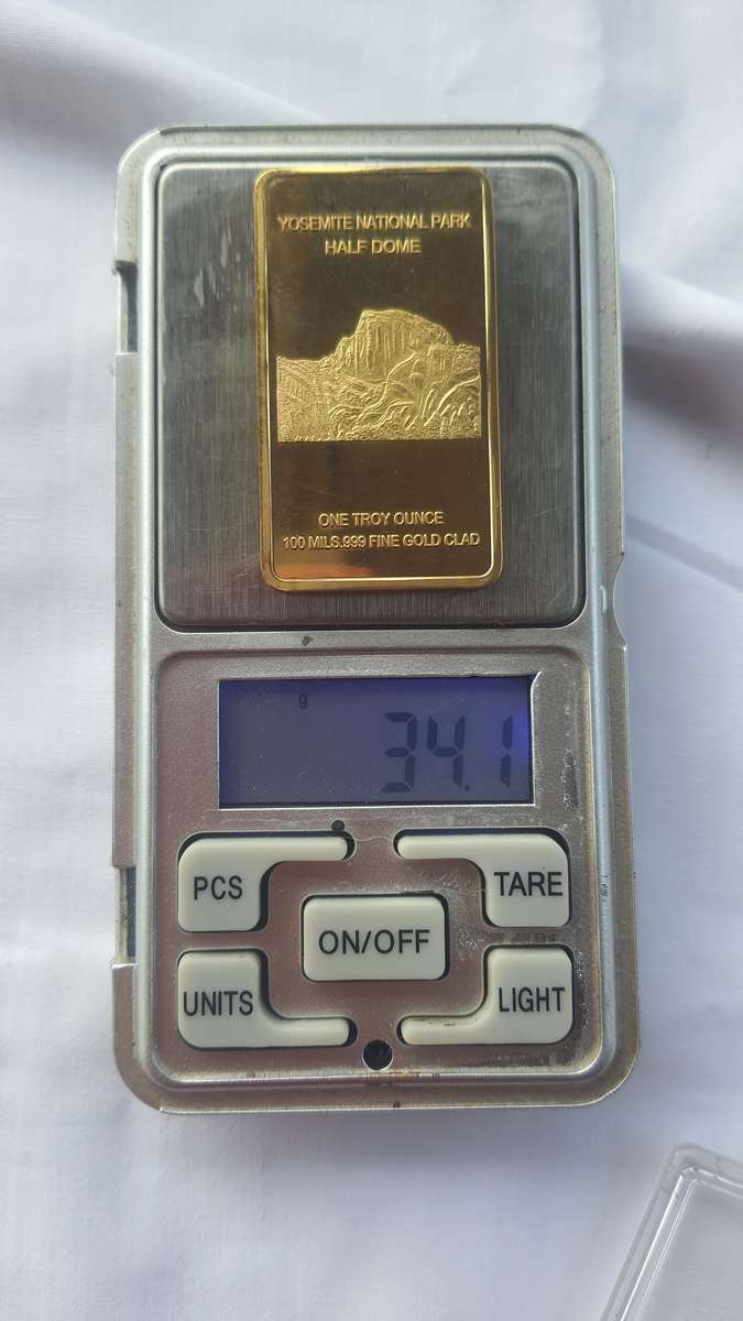 ONE TROY OUNCE 100 MILLS .999 Fine Gold glad bar up for grabs