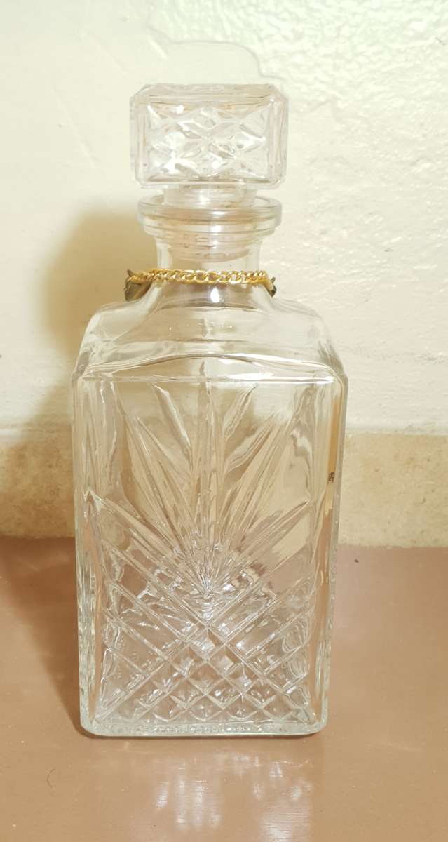 Demo stock - Cut glass modern whiskey decanter with brass whiskey tag in chain.