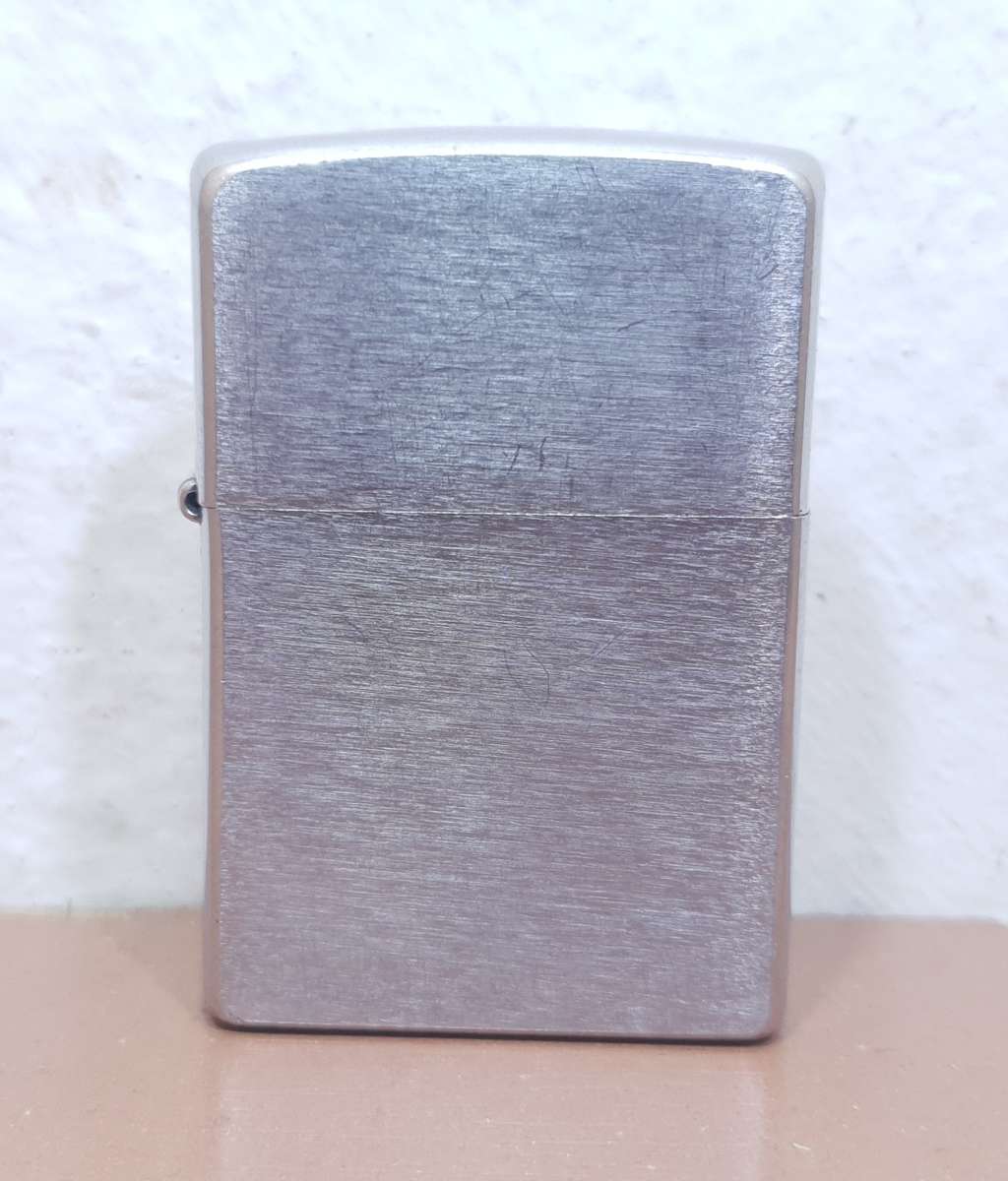 Demo stock - Authentic USA made Classic Brushed Chrome style Zippo Lighter in good condition.