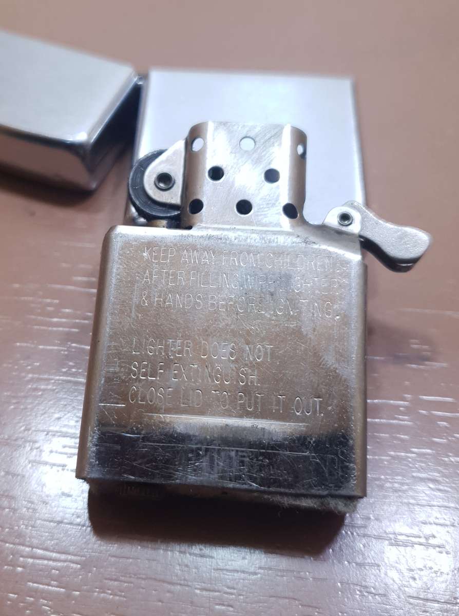 Demo stock - Authentic USA made Classic Brushed Chrome style Zippo Lighter in good condition.