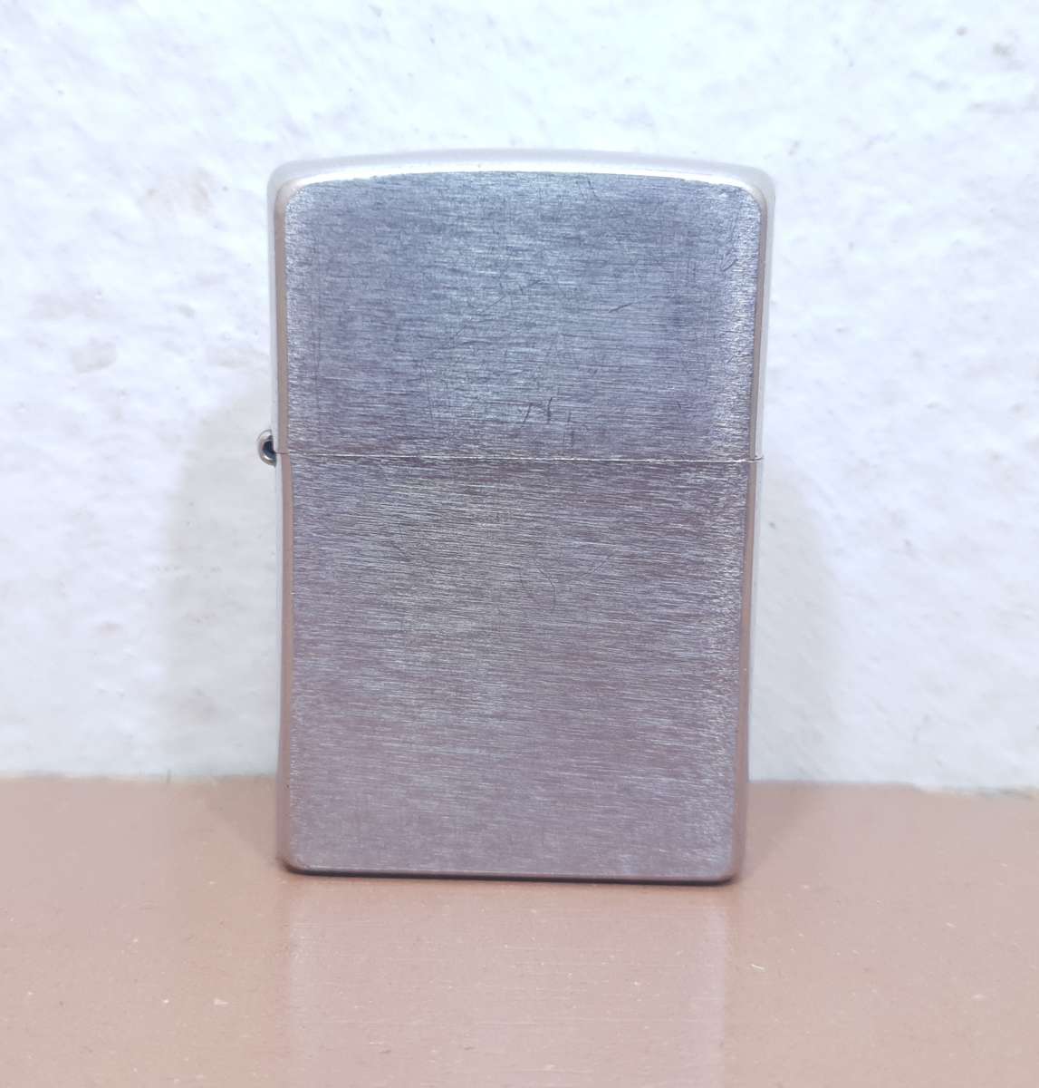Demo stock - Authentic USA made Classic Brushed Chrome style Zippo Lighter in good condition.