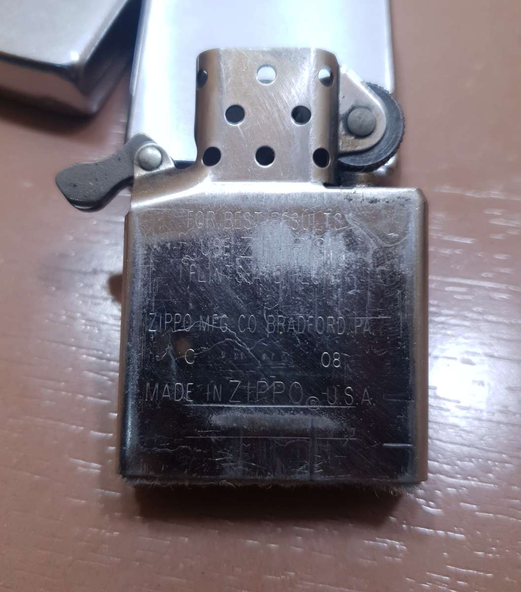 Demo stock - Authentic USA made Classic Brushed Chrome style Zippo Lighter in good condition.