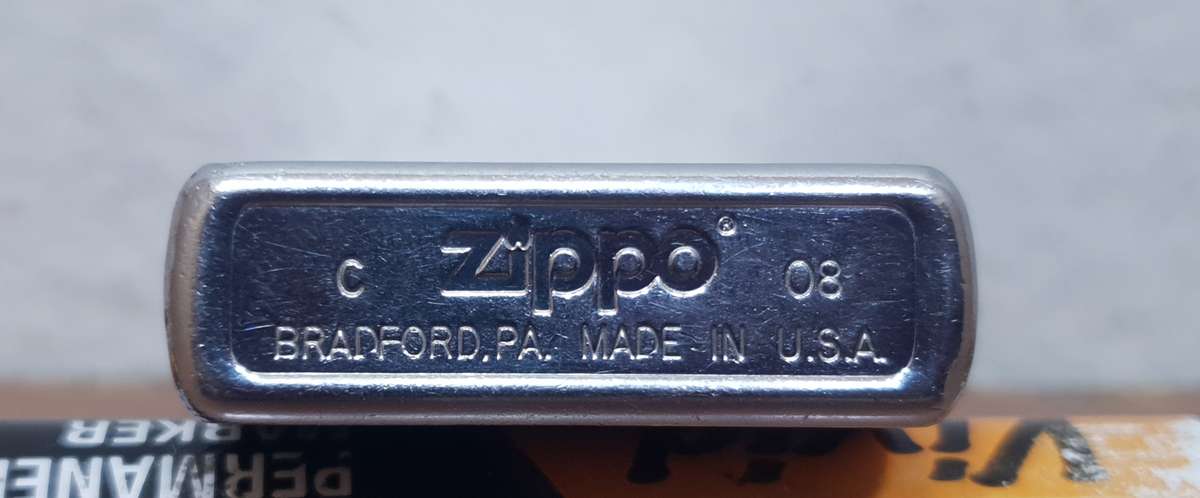 Demo stock - Authentic USA made Classic Brushed Chrome style Zippo Lighter in good condition.