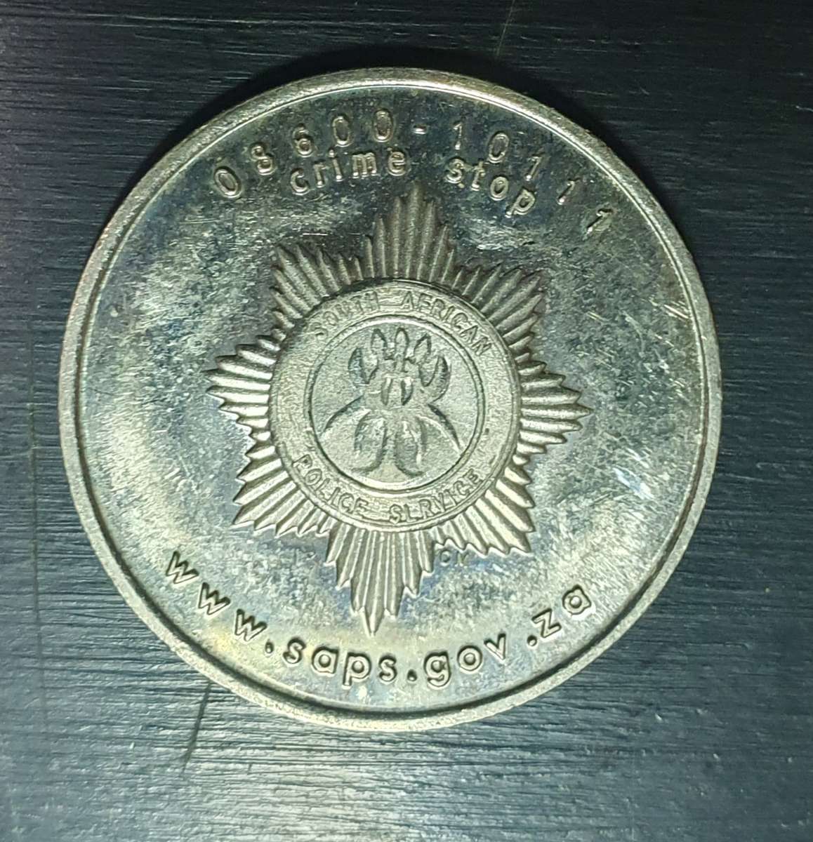 Collection of 4 tokens including a Van Reebeck & a SAPS coin by Coin World