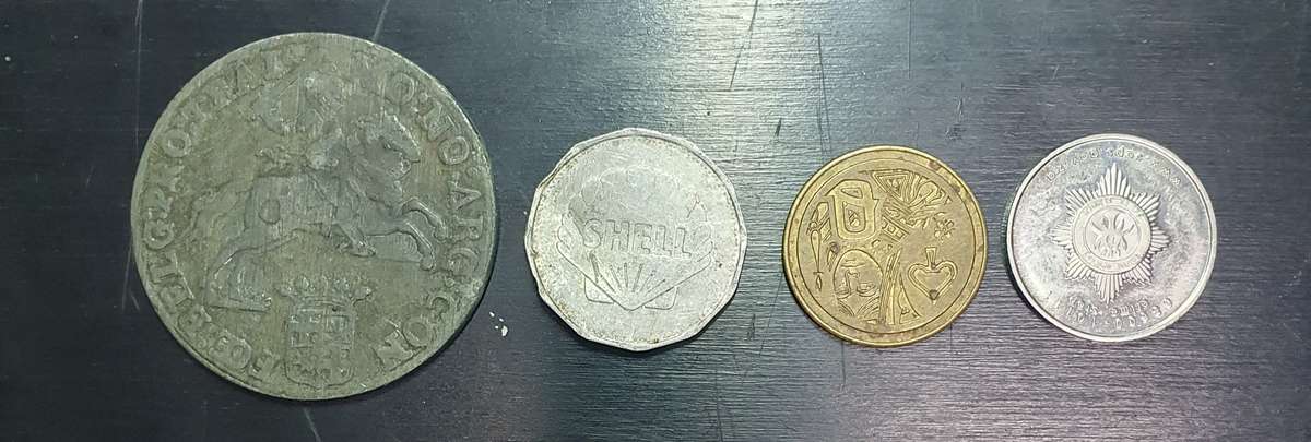 Collection of 4 tokens including a Van Reebeck & a SAPS coin by Coin World