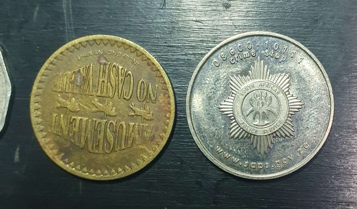 Collection of 4 tokens including a Van Reebeck & a SAPS coin by Coin World