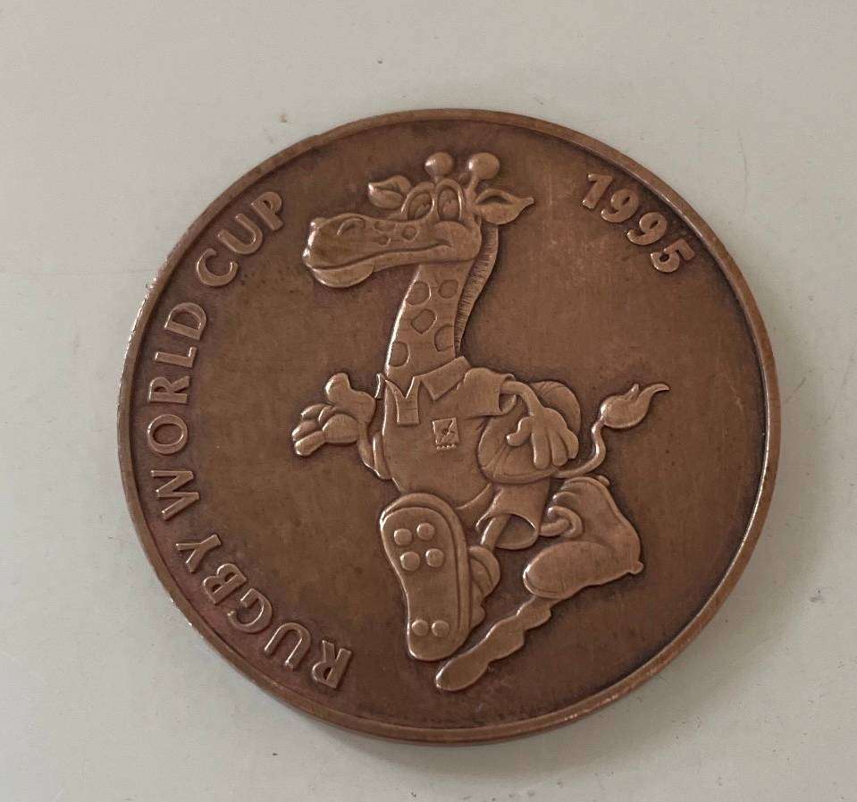 Rugby Medallion - 1995 World Cup - Copper coin with the mascot - "Ruggles" on it.