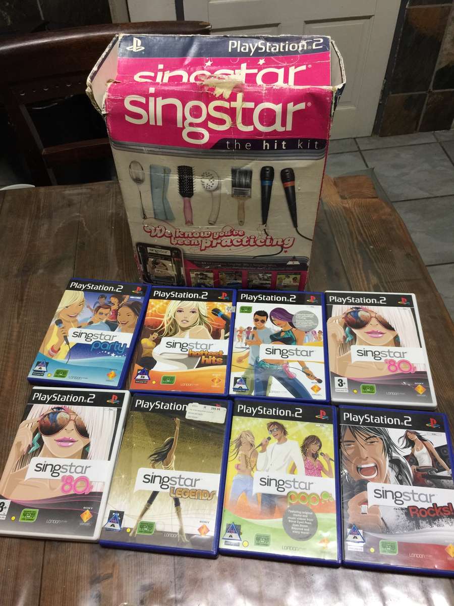 Play Station 2 complete +  Buzz + Singstar Games + 8MB Memory Card