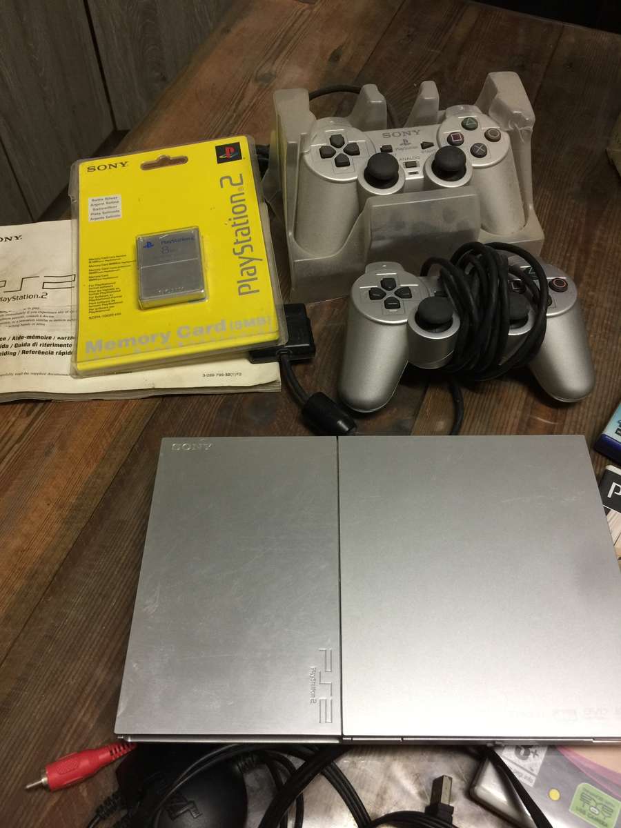 Play Station 2 complete +  Buzz + Singstar Games + 8MB Memory Card