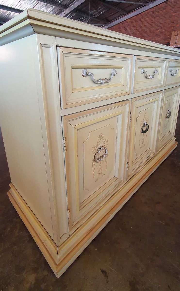Bernhardt inc French Provincial and Victorian style cabinet with Mable top on wheels.