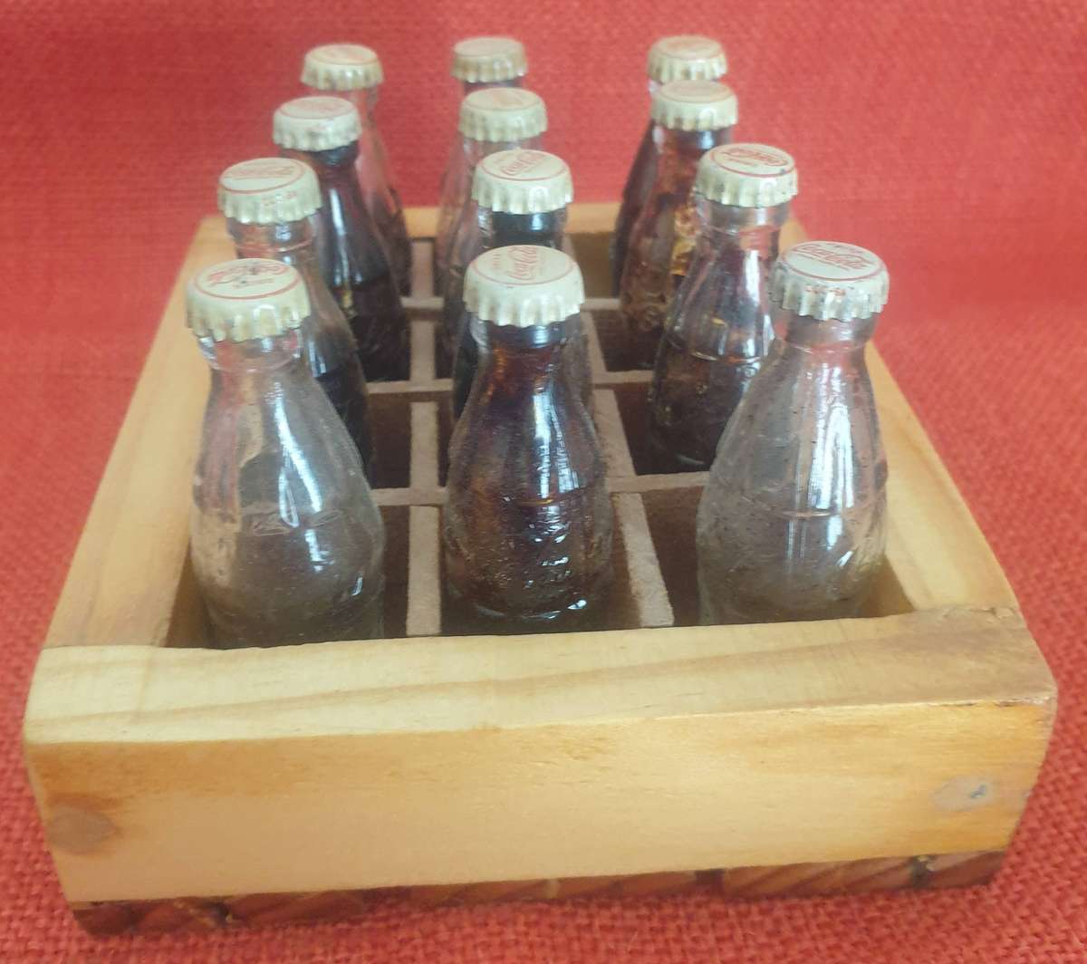 12 x Vintage miniature Coca-Cola bottles (with original caps)