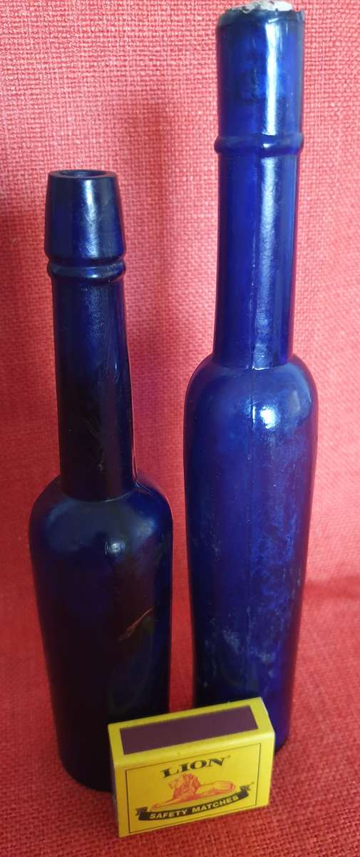 2 x very old cobalt blue castor oil bottles