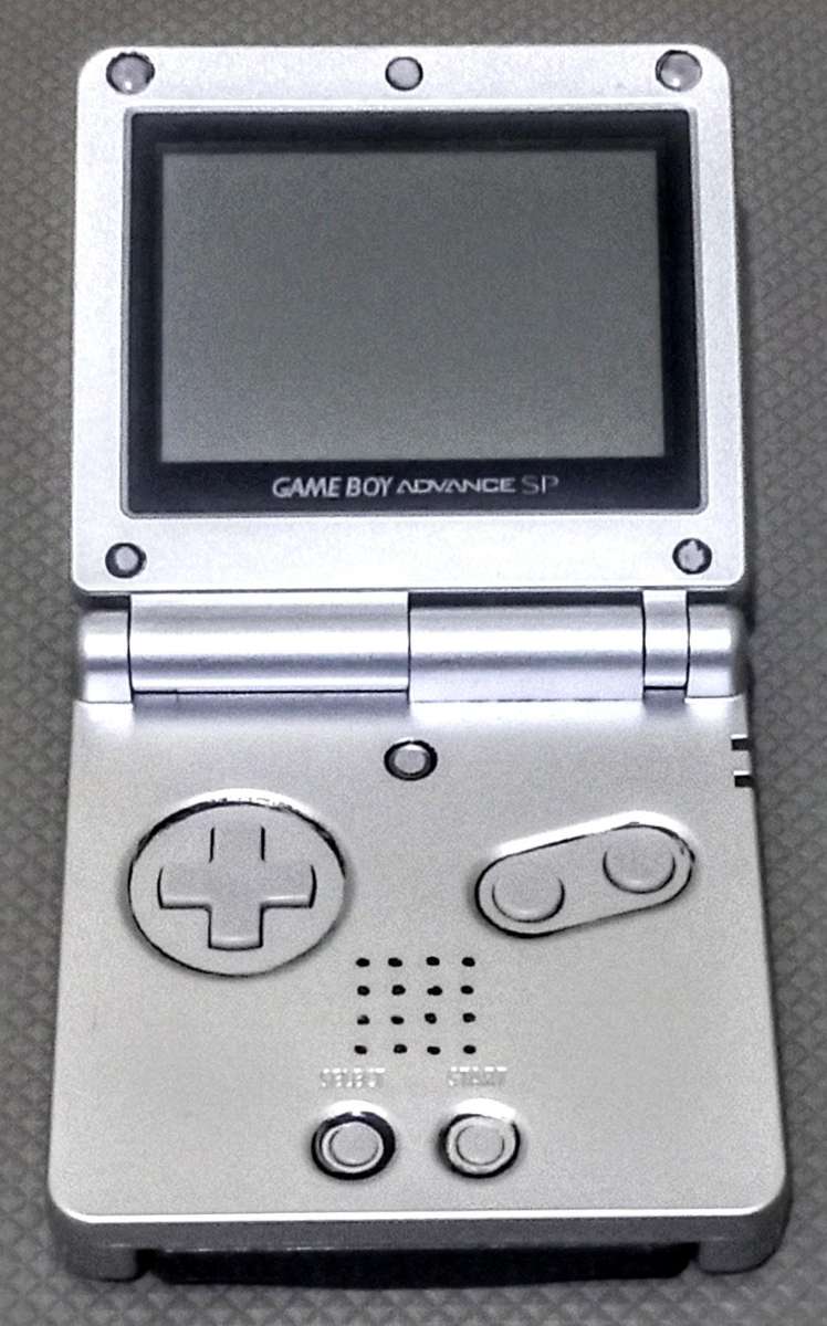 Silver Nintendo Gameboy Advance SP Console in working condition with Lion King Game