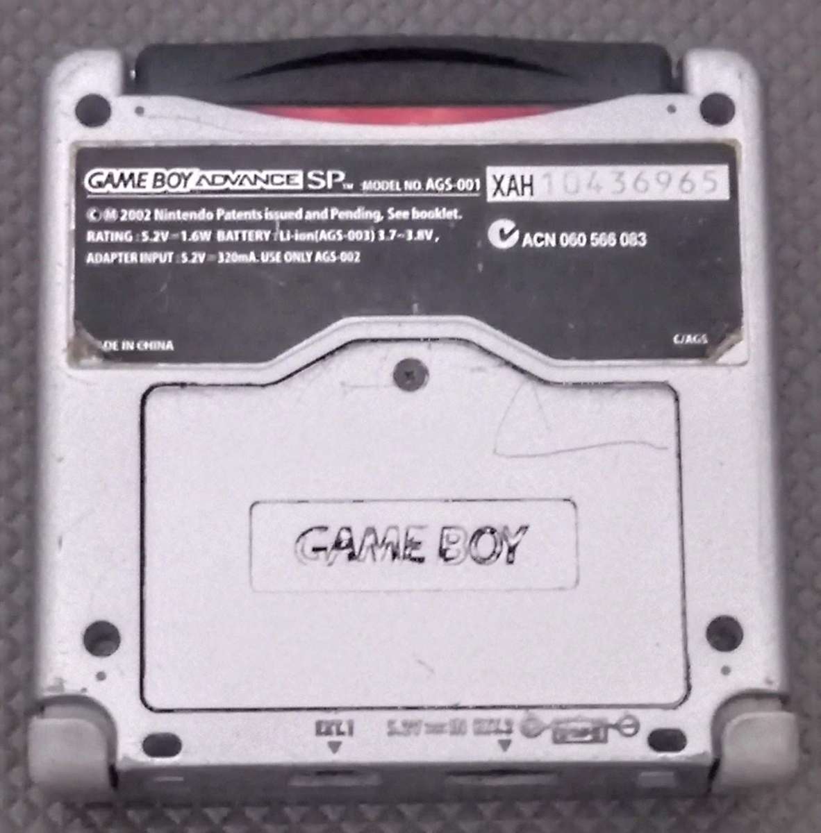 Silver Nintendo Gameboy Advance SP Console in working condition with Lion King Game