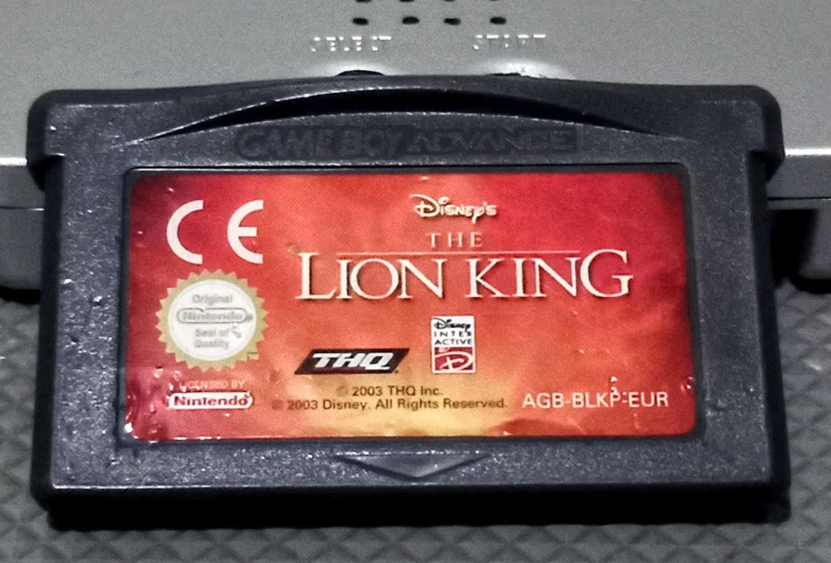 Silver Nintendo Gameboy Advance SP Console in working condition with Lion King Game