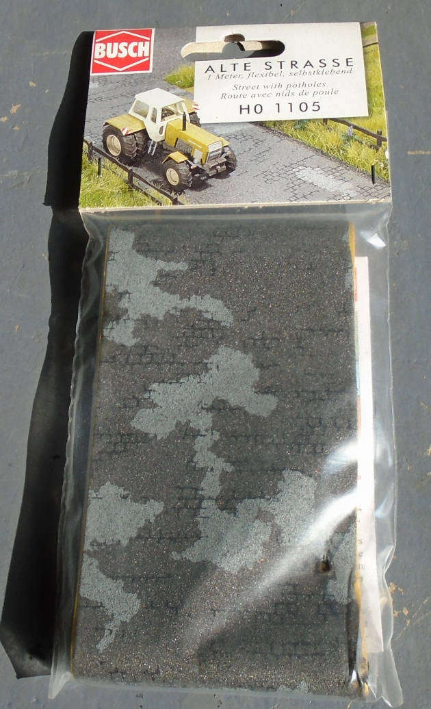 BUSCH HO SCALE - STREET WITH POTHOLES 1M, IN BAG