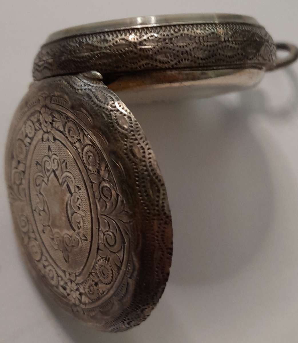 Vintage silver casing decorative and ornate swiss made pocket watch