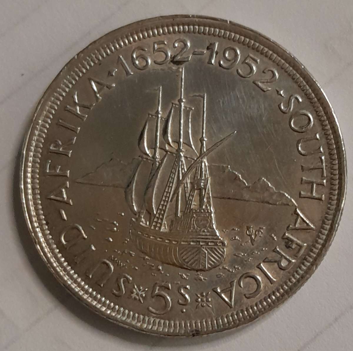 300 year aniversay of the establishment of Cape Town comemorative 5 shilling silver coin