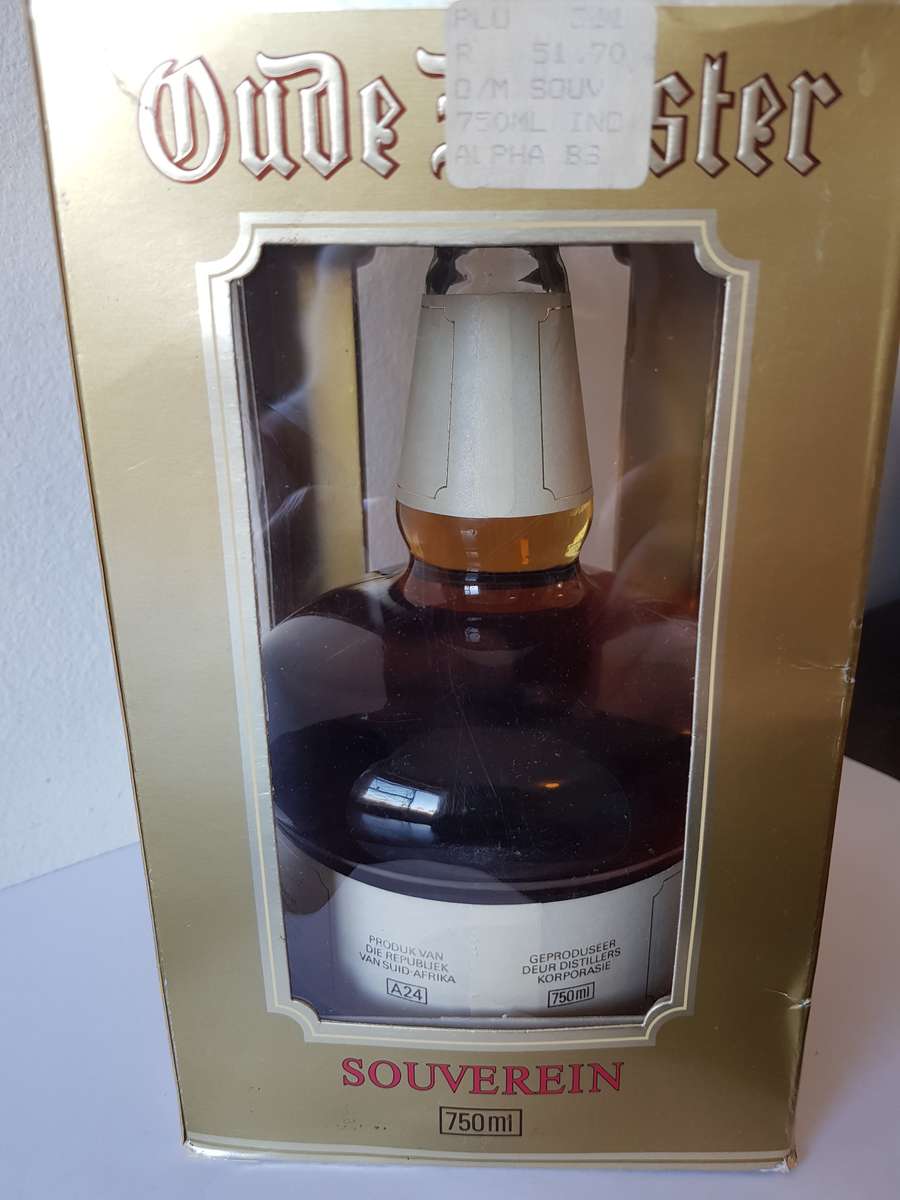 VINTAGE OUDEMEESTER SOUVEREIN POTSTILLED 12 YEAR OLD BRANDY IN UNIQUE SHAPED DECANTER.