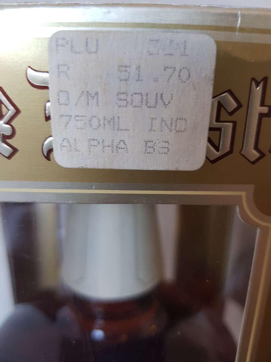 VINTAGE OUDEMEESTER SOUVEREIN POTSTILLED 12 YEAR OLD BRANDY IN UNIQUE SHAPED DECANTER.